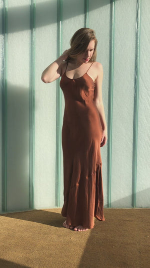
                  
                    Load and play video in Gallery viewer, Long slip dress made with organic mulberry silk dyed to a rich caramelized brown.
                  
                