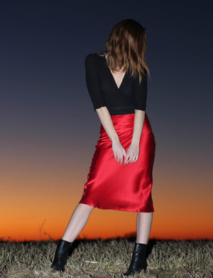 
                  
                    Vibrant red midi skirt made from natural mulberry silk. Pairs perfectly with a white tee or your favorite linen blouse.
                  
                